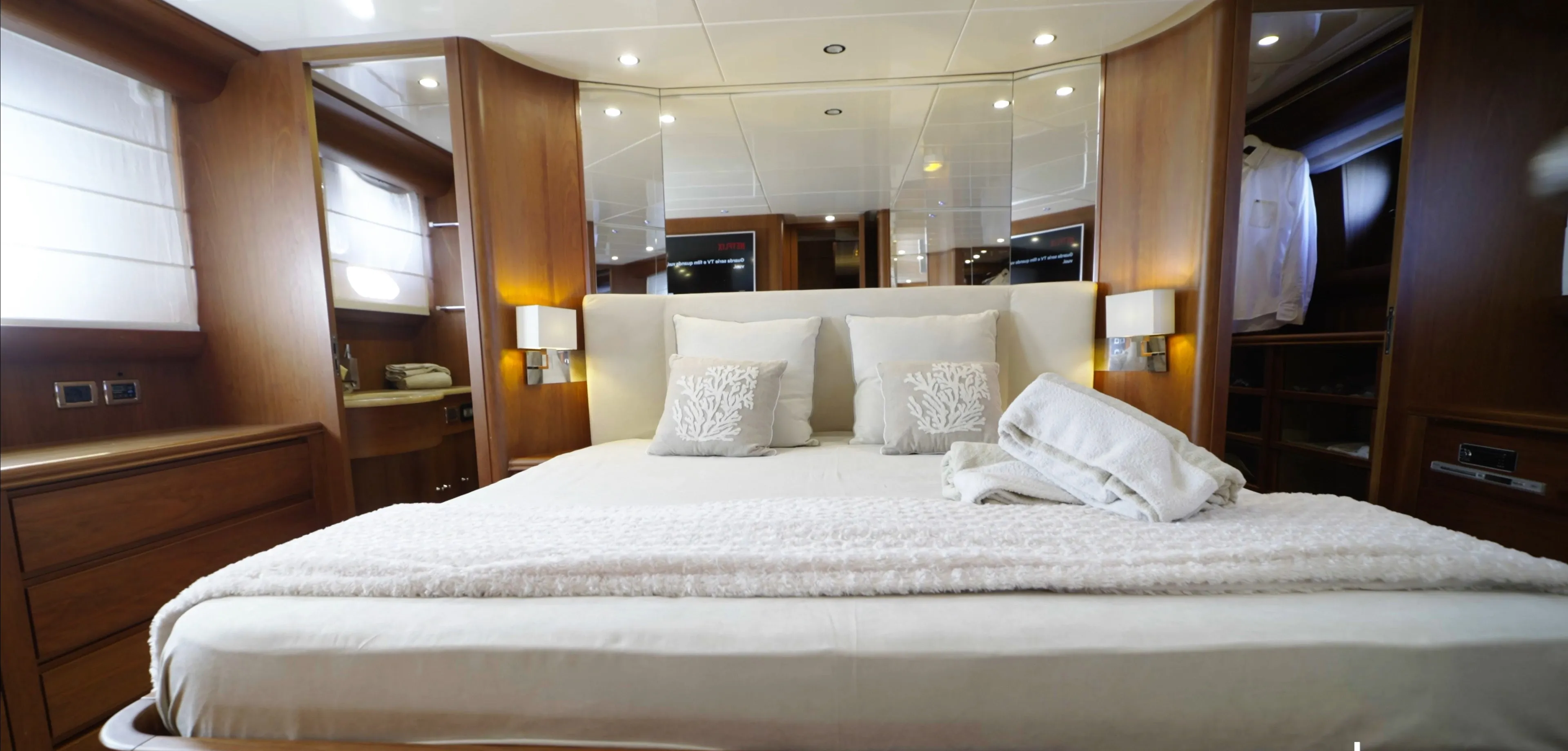 The Panarea master suite, full beam, the bed made up under the side windows