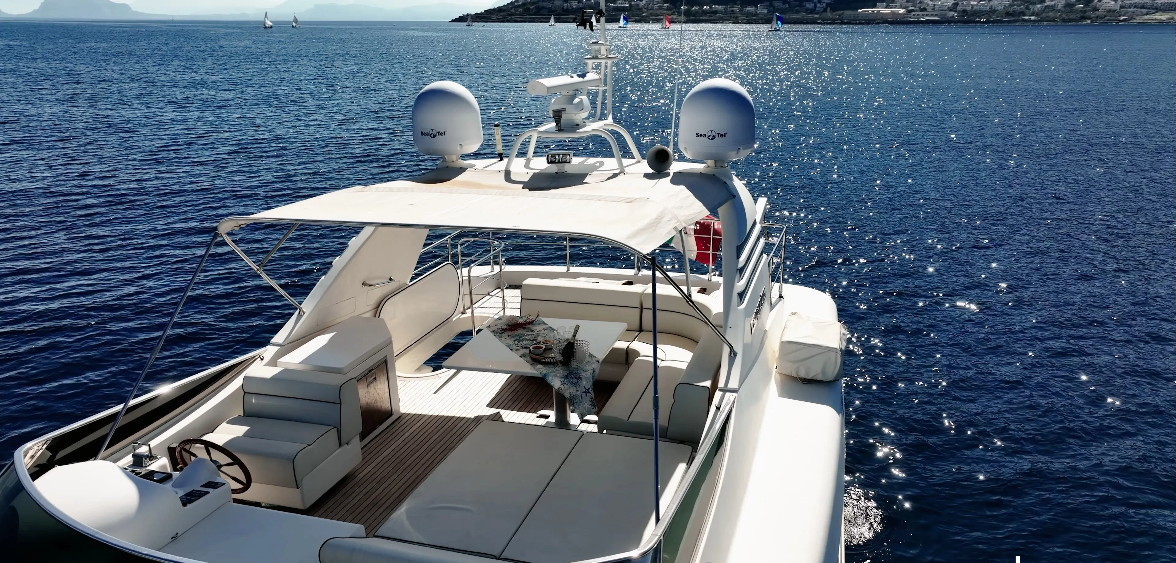The flybridge with its chaise longues and the sunpad forward