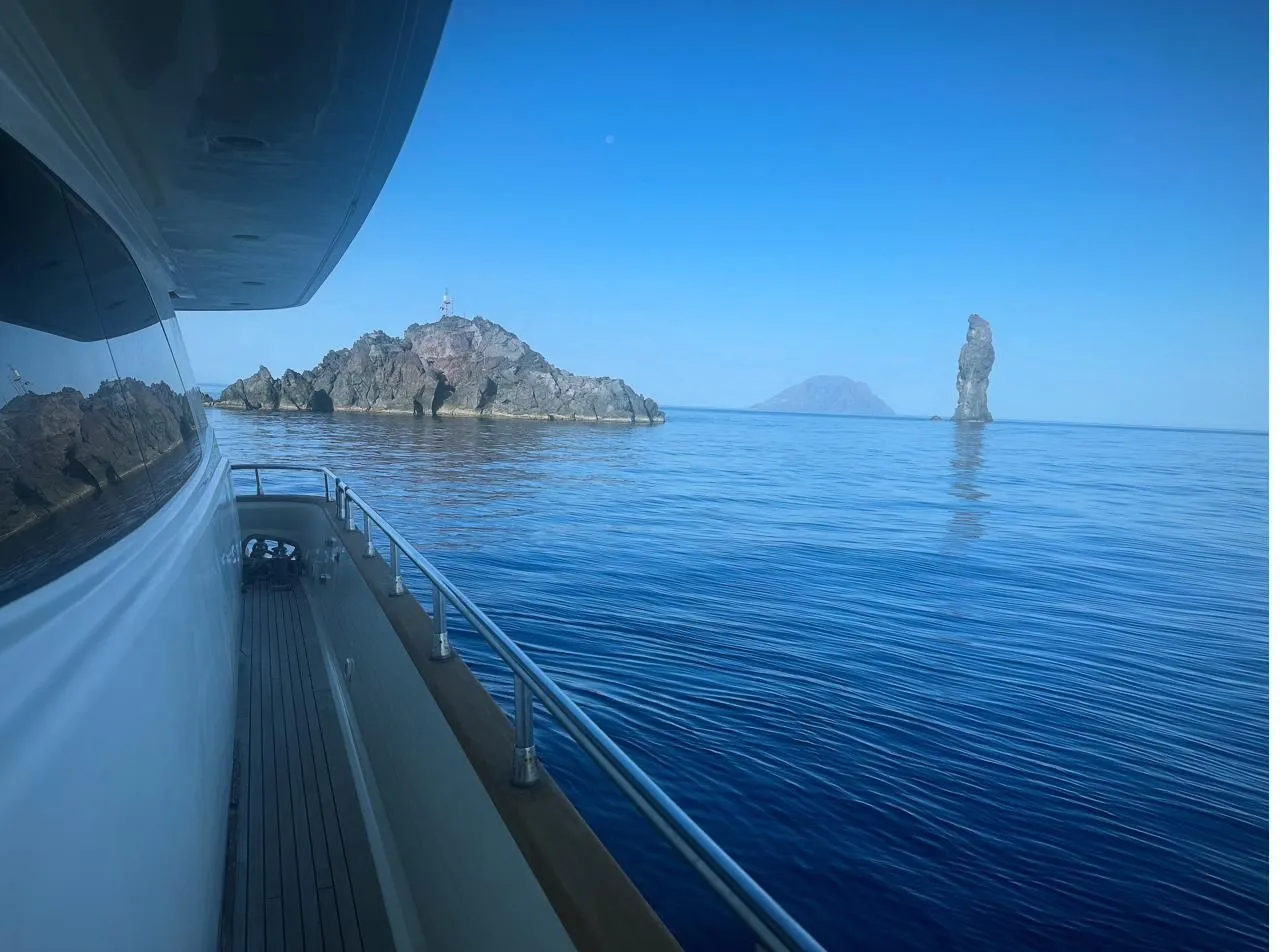 La Canna rising out of the sea off Filicudi, with Alicudi behind