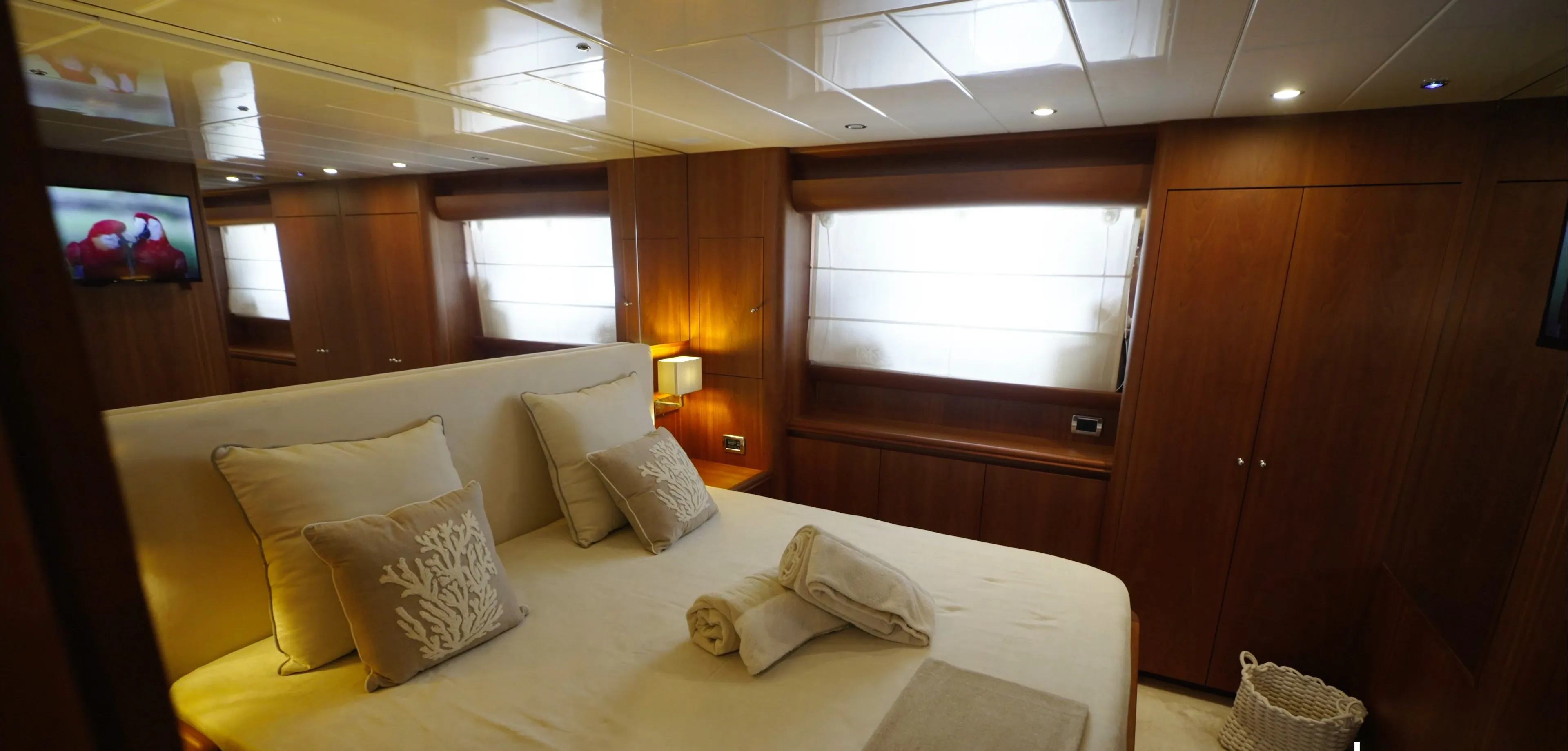 The Salina VIP suite, king size bed, wardrobes along the side and daylight through the blind